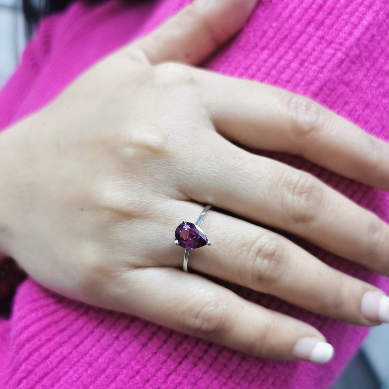 18K white gold pear-shaped Rhodolite ring with a smooth polished band, featuring a minimalist and timeless design.