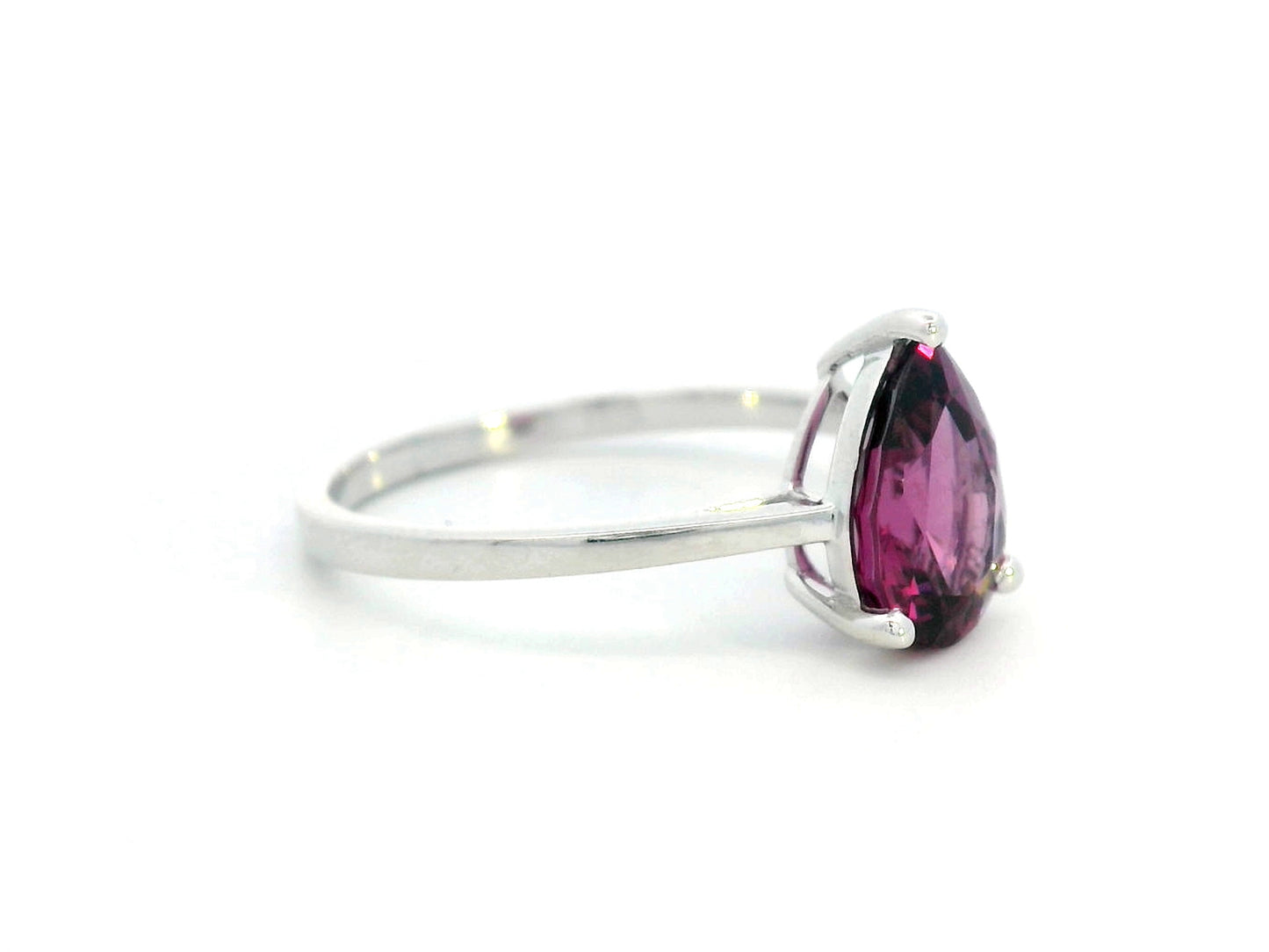18K white gold pear-shaped Rhodolite ring with a smooth polished band, featuring a minimalist and timeless design.