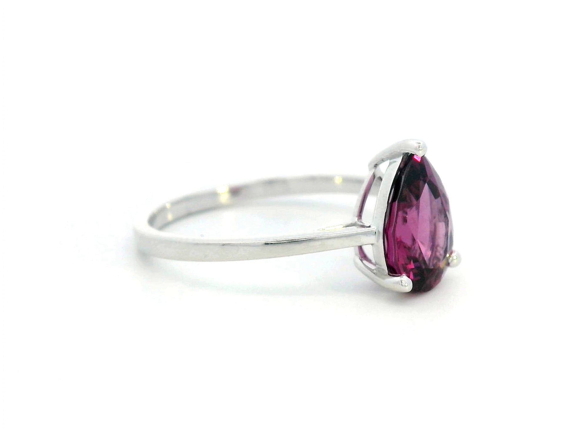 18K white gold pear-shaped Rhodolite ring with a smooth polished band, featuring a minimalist and timeless design.