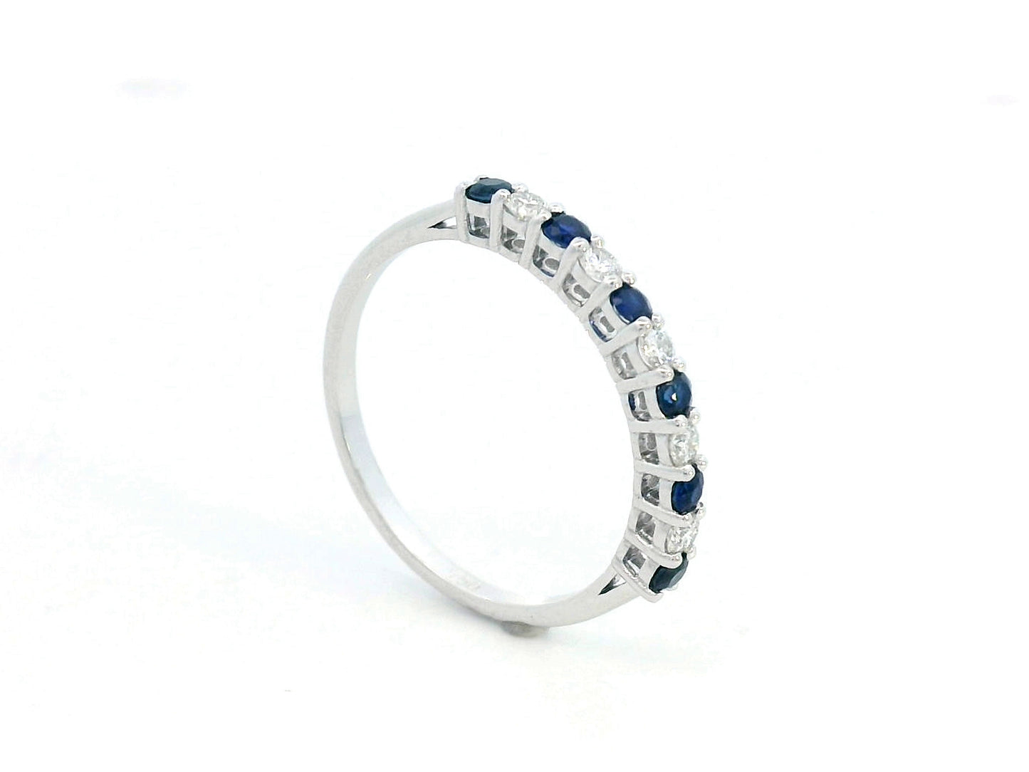 18K white gold half eternity ring with alternating 0.28 CT blue sapphires and 0.18 CT diamonds, perfect as a wedding or stacking ring.