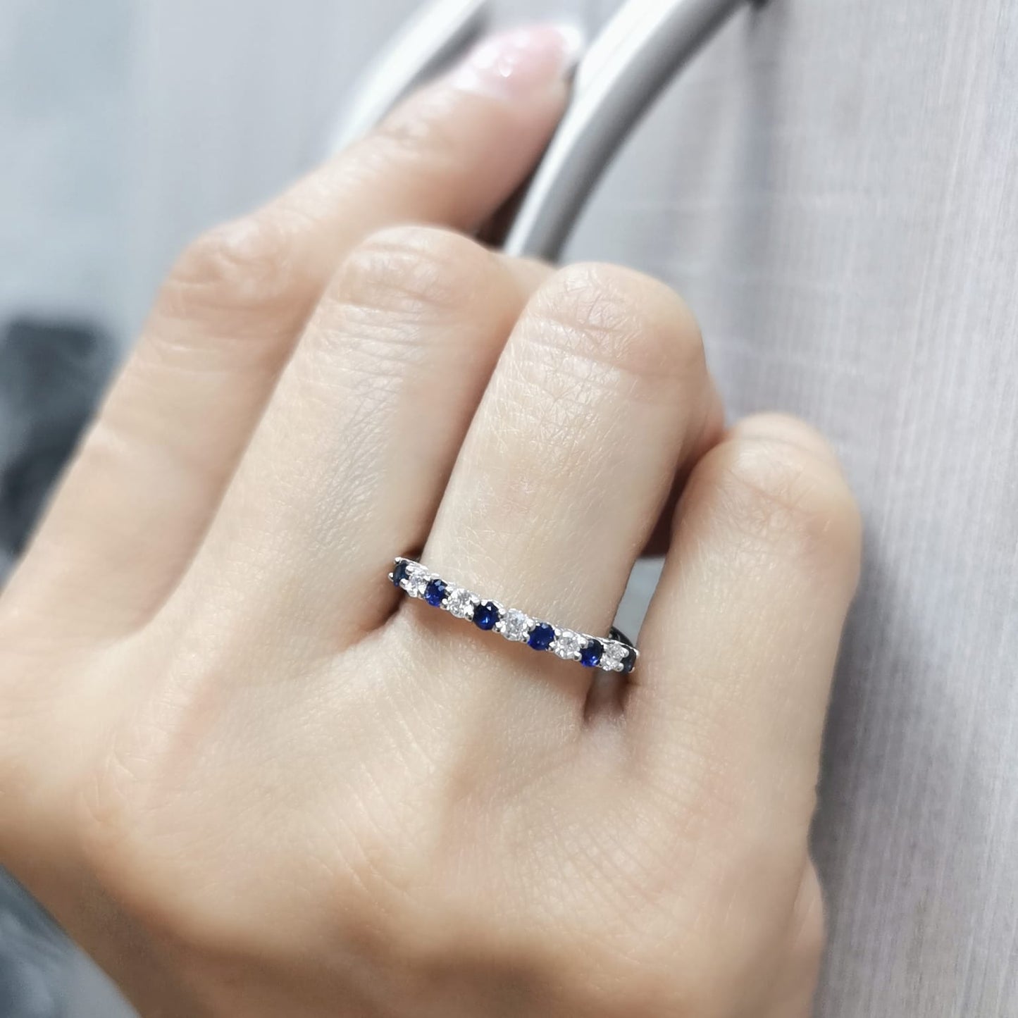 18K white gold half eternity ring with alternating 0.28 CT blue sapphires and 0.18 CT diamonds, perfect as a wedding or stacking ring.