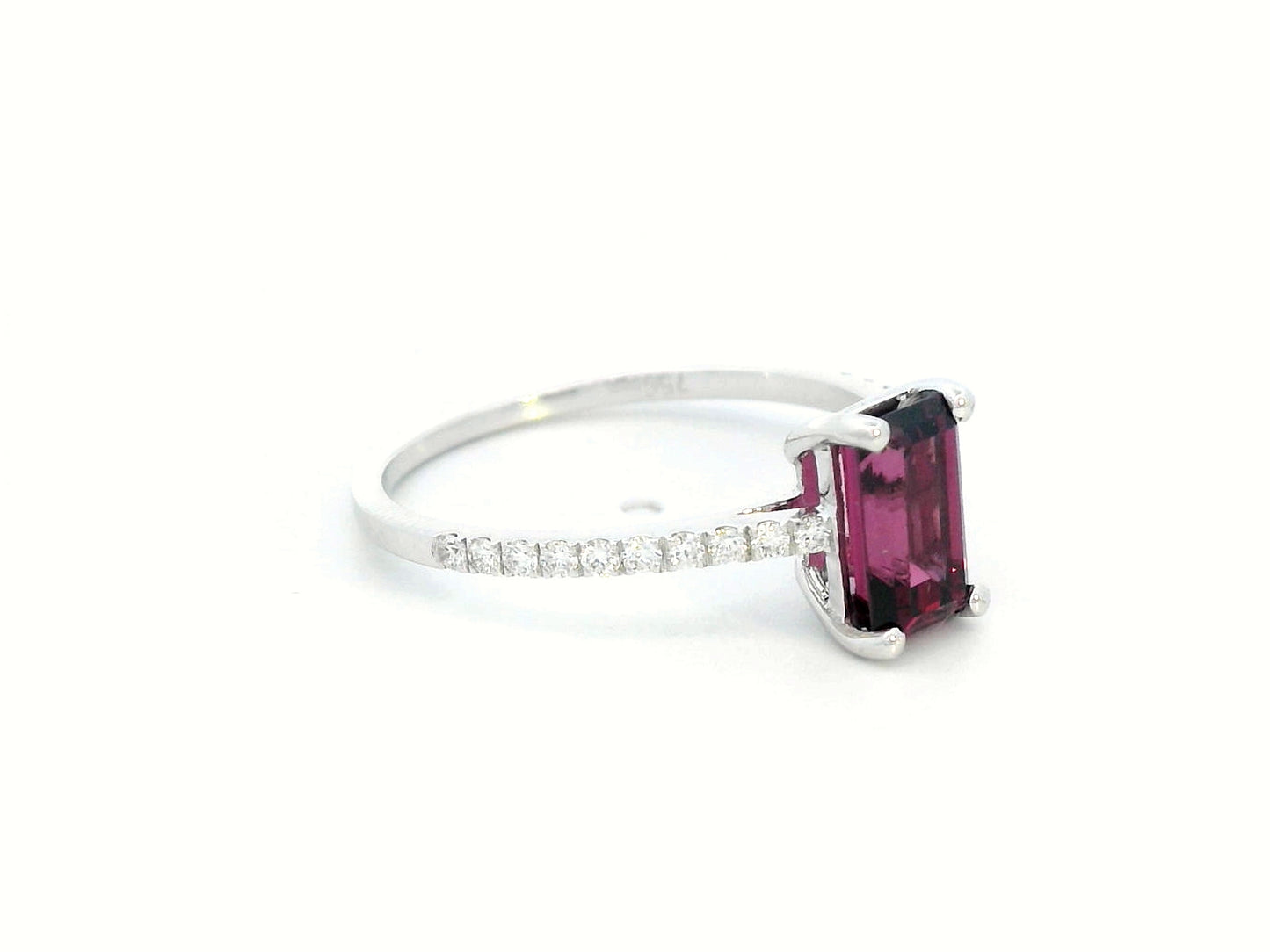 18K white gold ring featuring a 1.46-carat emerald-cut Rhodolite with 0.18 carats of diamonds on the band.