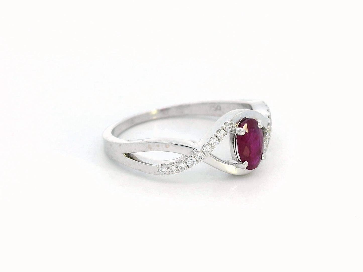 18K White Gold Infinity Ring with 0.48 Carat Oval Ruby and 0.09 Carat Diamonds