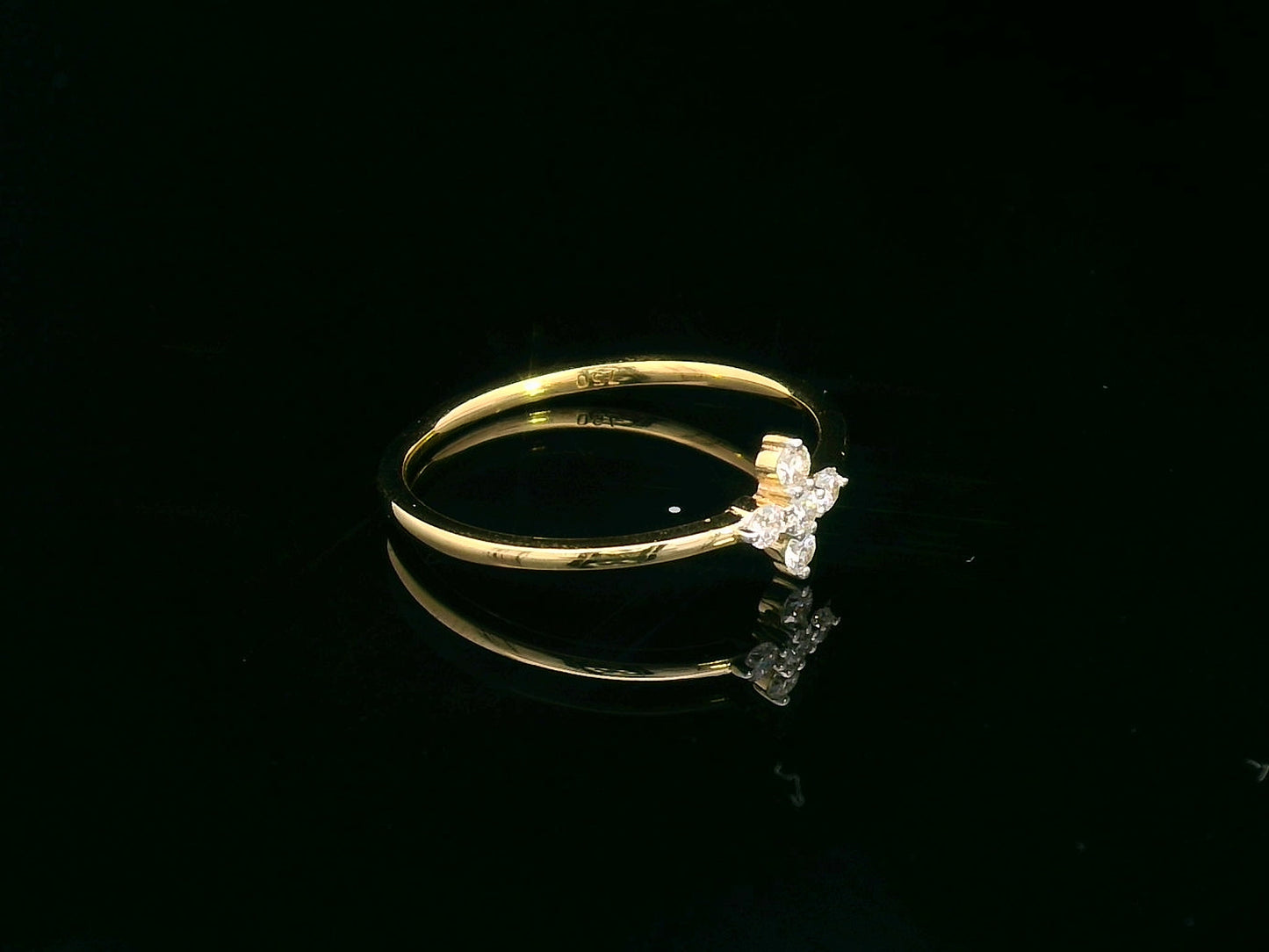 Minimalist 18K gold diamond cluster ring featuring a dainty 0.13ct floral-inspired design, perfect for stacking or daily wear.