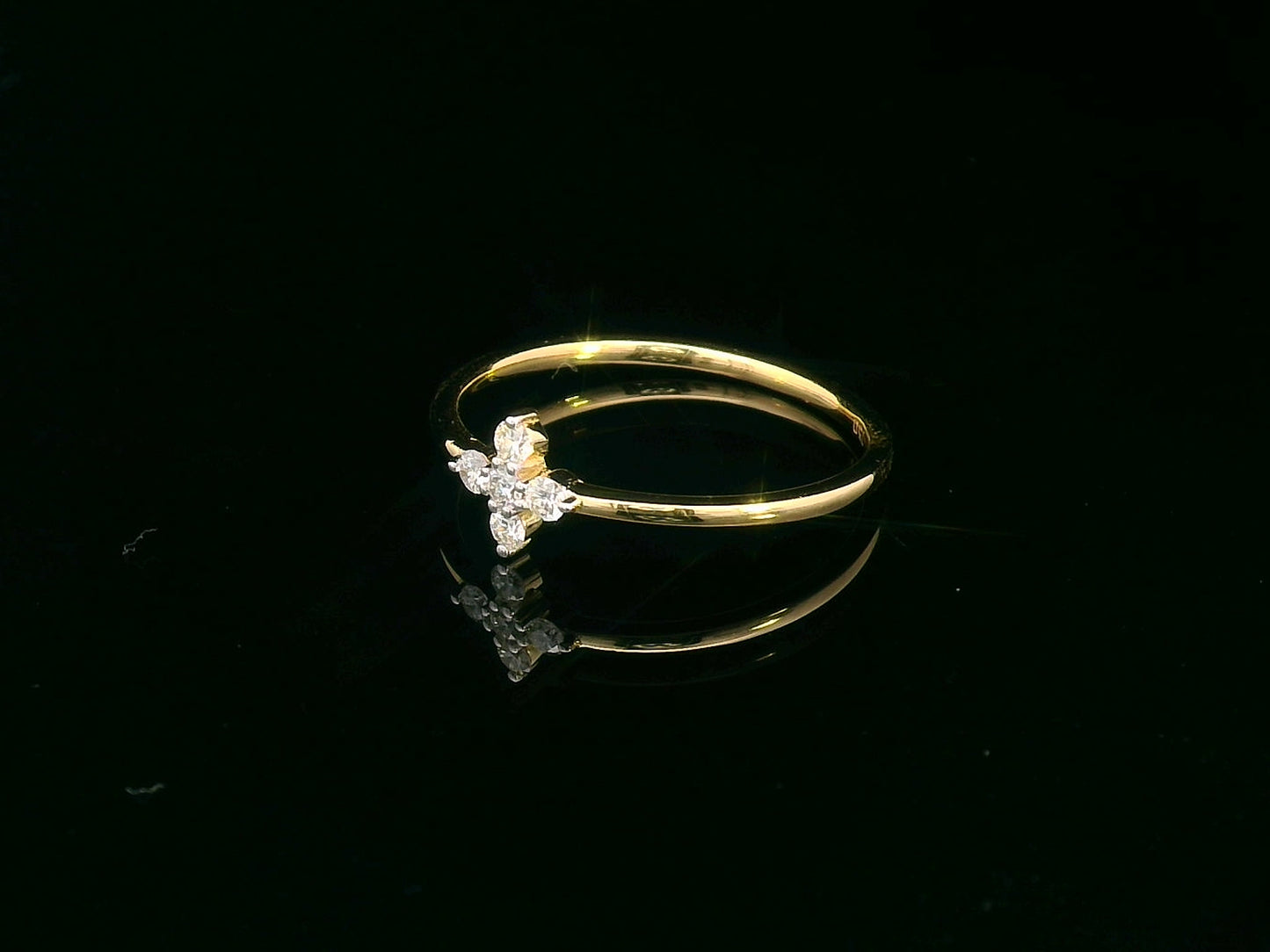 Minimalist 18K gold diamond cluster ring featuring a dainty 0.13ct floral-inspired design, perfect for stacking or daily wear.