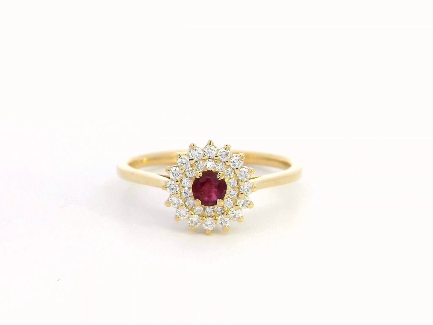18K gold ruby and diamond halo ring featuring a 0.20-carat deep red ruby and 0.22-carat diamond halo – a vintage-inspired birthstone and engagement ring