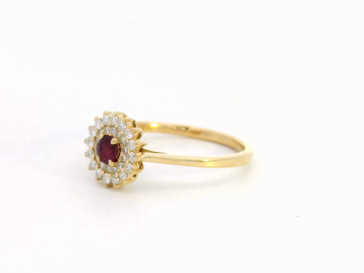 18K gold ruby and diamond halo ring featuring a 0.20-carat deep red ruby and 0.22-carat diamond halo – a vintage-inspired birthstone and engagement ring