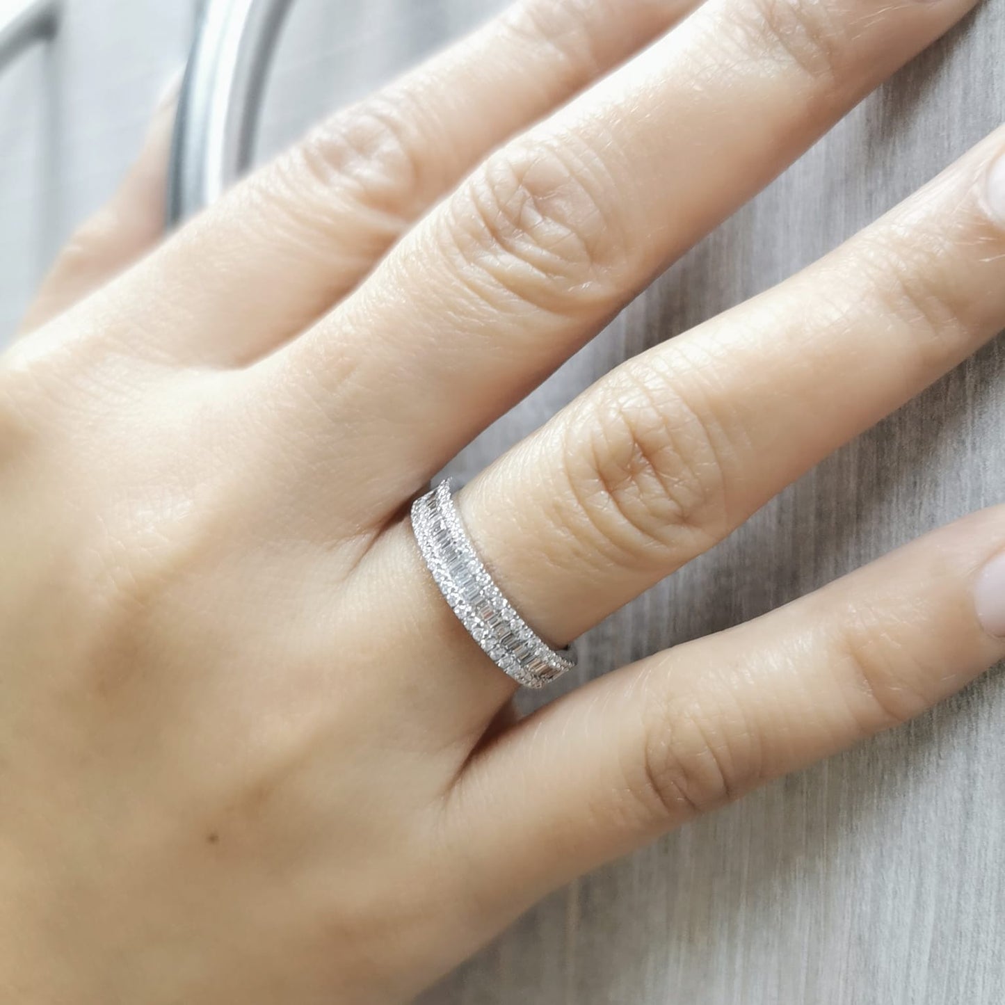 18K gold diamond band featuring 0.67 carats of round and baguette-cut diamonds – perfect as a wedding band, stackable ring, or statement jewelry.