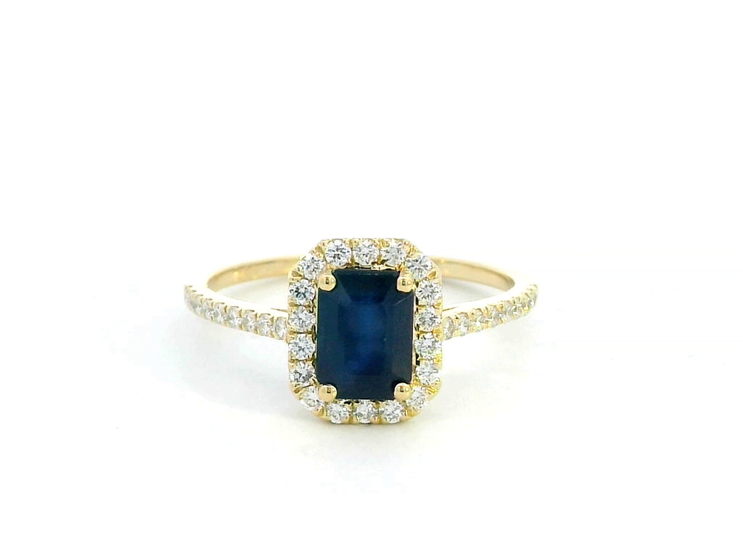Emerald cut blue sapphire ring with diamond halo in 18K yellow gold – 1.43 CT sapphire, 0.34 CT diamonds