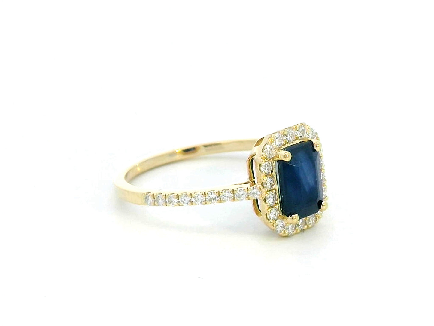 Emerald cut blue sapphire ring with diamond halo in 18K yellow gold – 1.43 CT sapphire, 0.34 CT diamonds