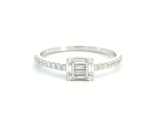 Delicate 18K gold ring featuring 0.28 carats of round and baguette diamonds, set on a slim, diamond-studded band. A timeless piece for any occasion