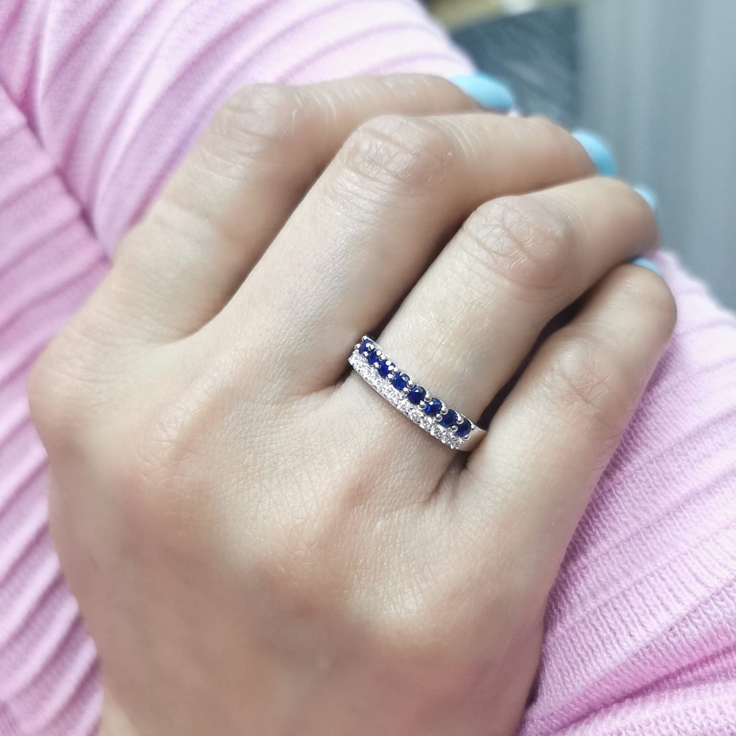 Elegant 18K gold sapphire and diamond ring featuring 0.54 carats of deep blue sapphires and 0.19 carats of brilliant diamonds. A timeless stacking band for weddings, anniversaries, and daily elegance.
