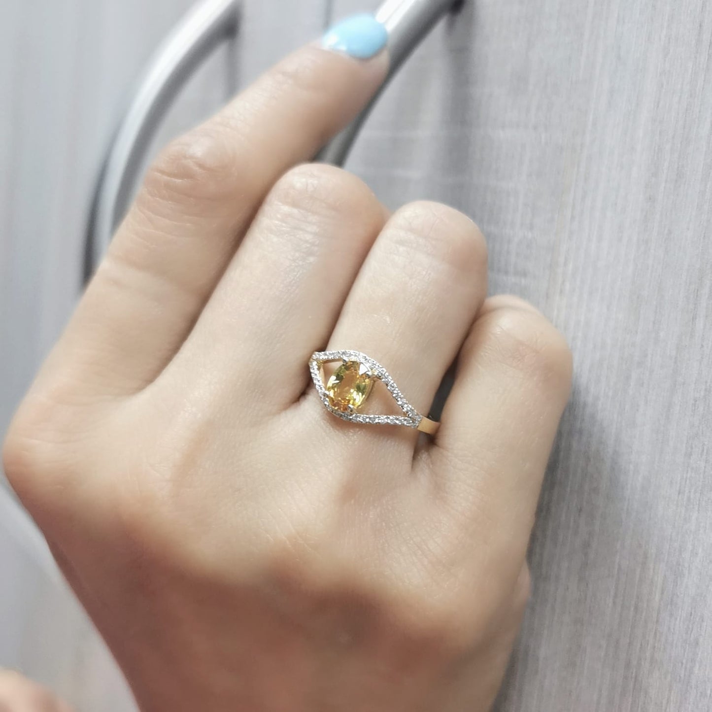 Elegant 18K gold yellow sapphire and diamond ring featuring a 1.05-carat yellow sapphire and 0.22 carats of brilliant diamonds in an open-frame design
