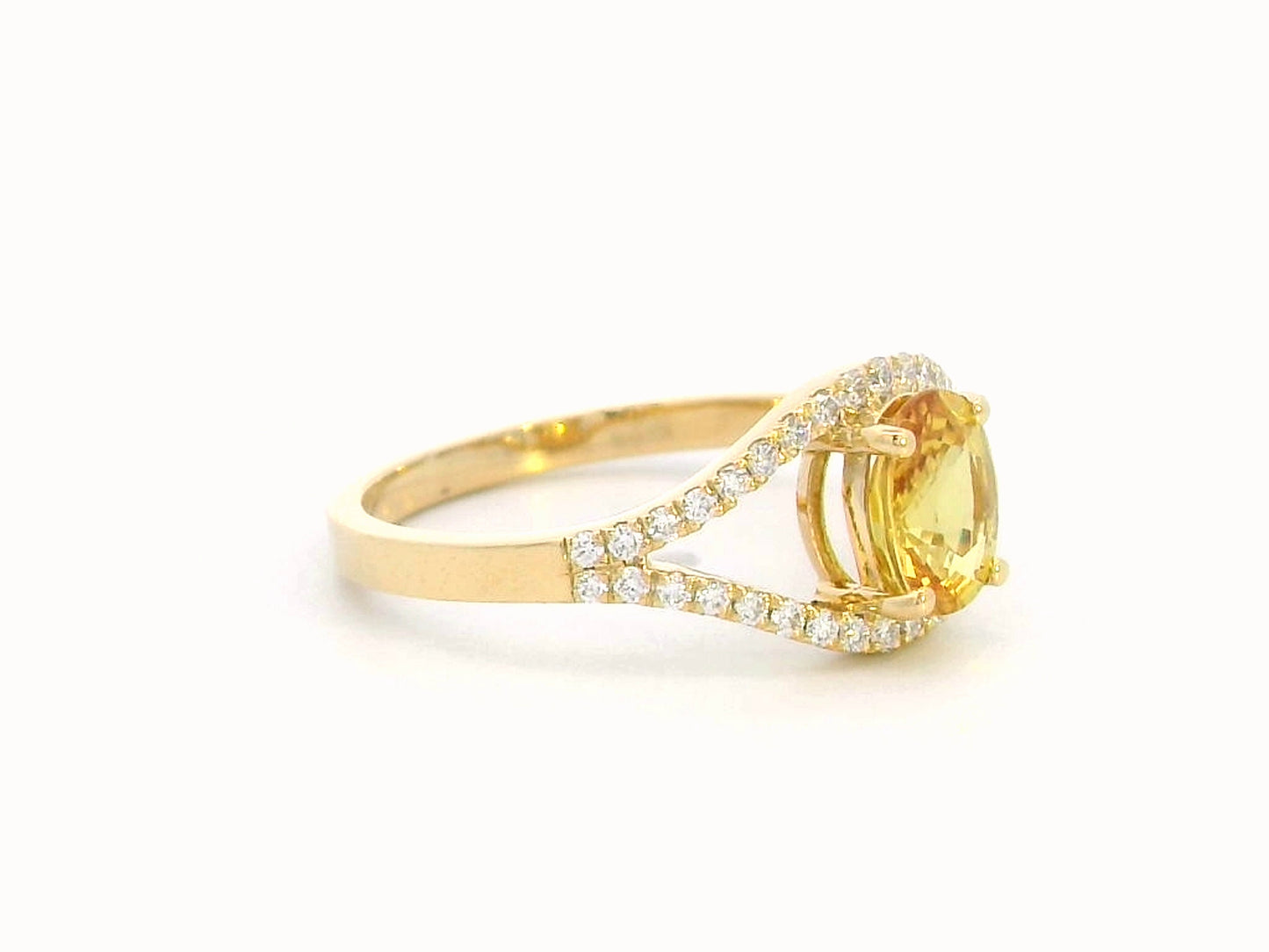 Elegant 18K gold yellow sapphire and diamond ring featuring a 1.05-carat yellow sapphire and 0.22 carats of brilliant diamonds in an open-frame design