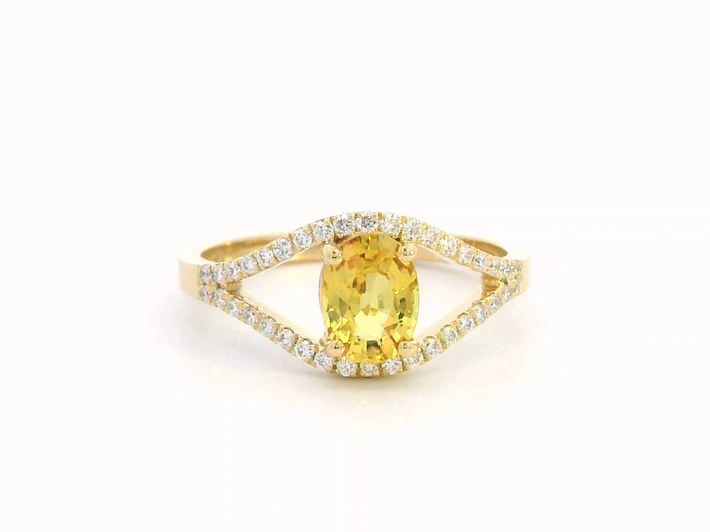 Elegant 18K gold yellow sapphire and diamond ring featuring a 1.05-carat yellow sapphire and 0.22 carats of brilliant diamonds in an open-frame design