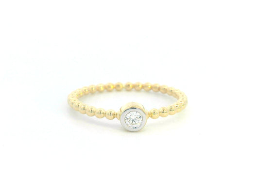 Minimalist 18K gold beaded band ring with a bezel-set 0.08ct diamond, perfect for stacking or everyday wear.