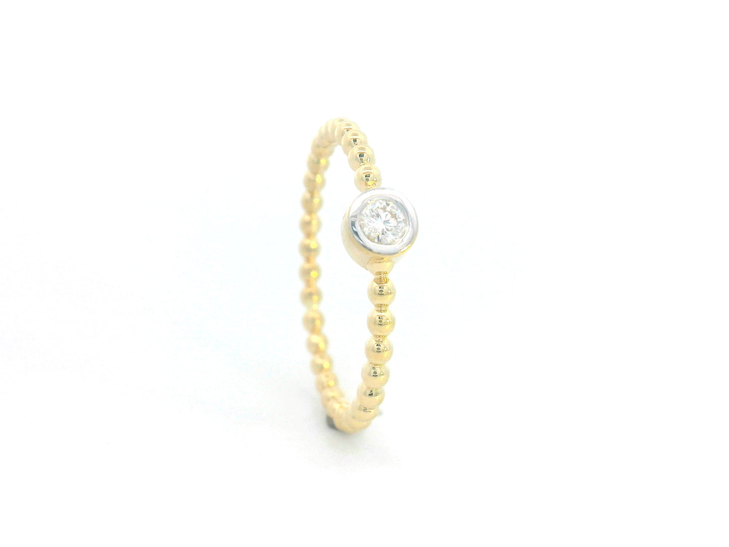 Minimalist 18K gold beaded band ring with a bezel-set 0.08ct diamond, perfect for stacking or everyday wear.