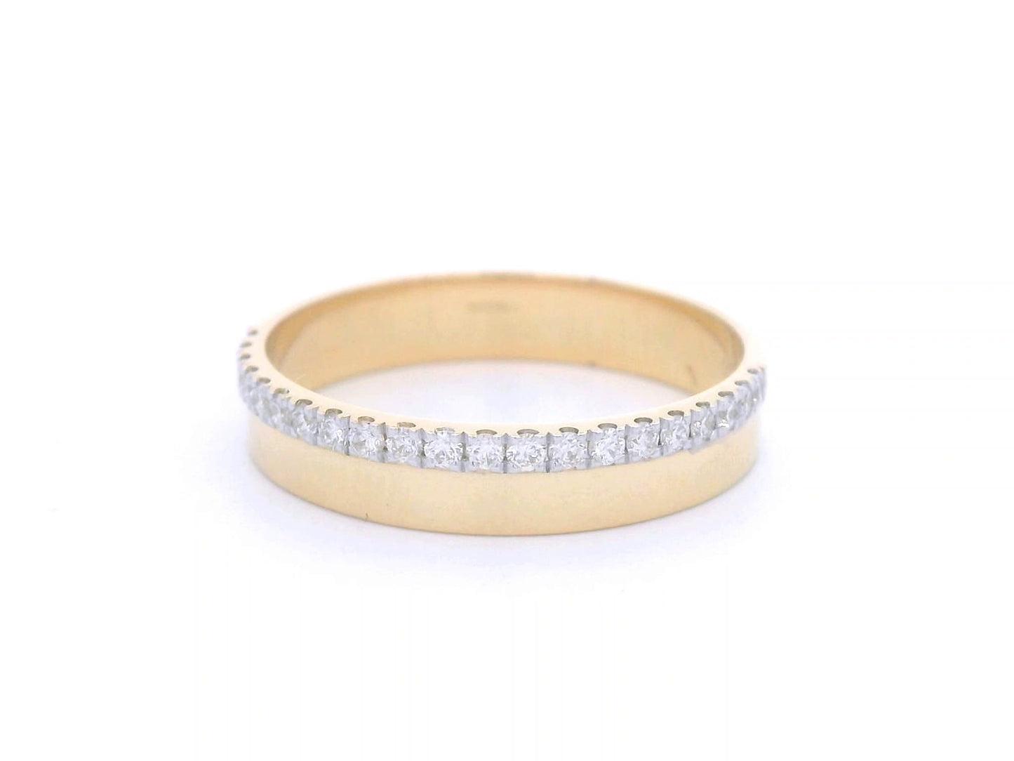 Elegant 18K gold diamond edge band featuring a delicate row of 0.20-carat diamonds along one side, perfect as a wedding band, stacking ring, or unisex fashion ring.