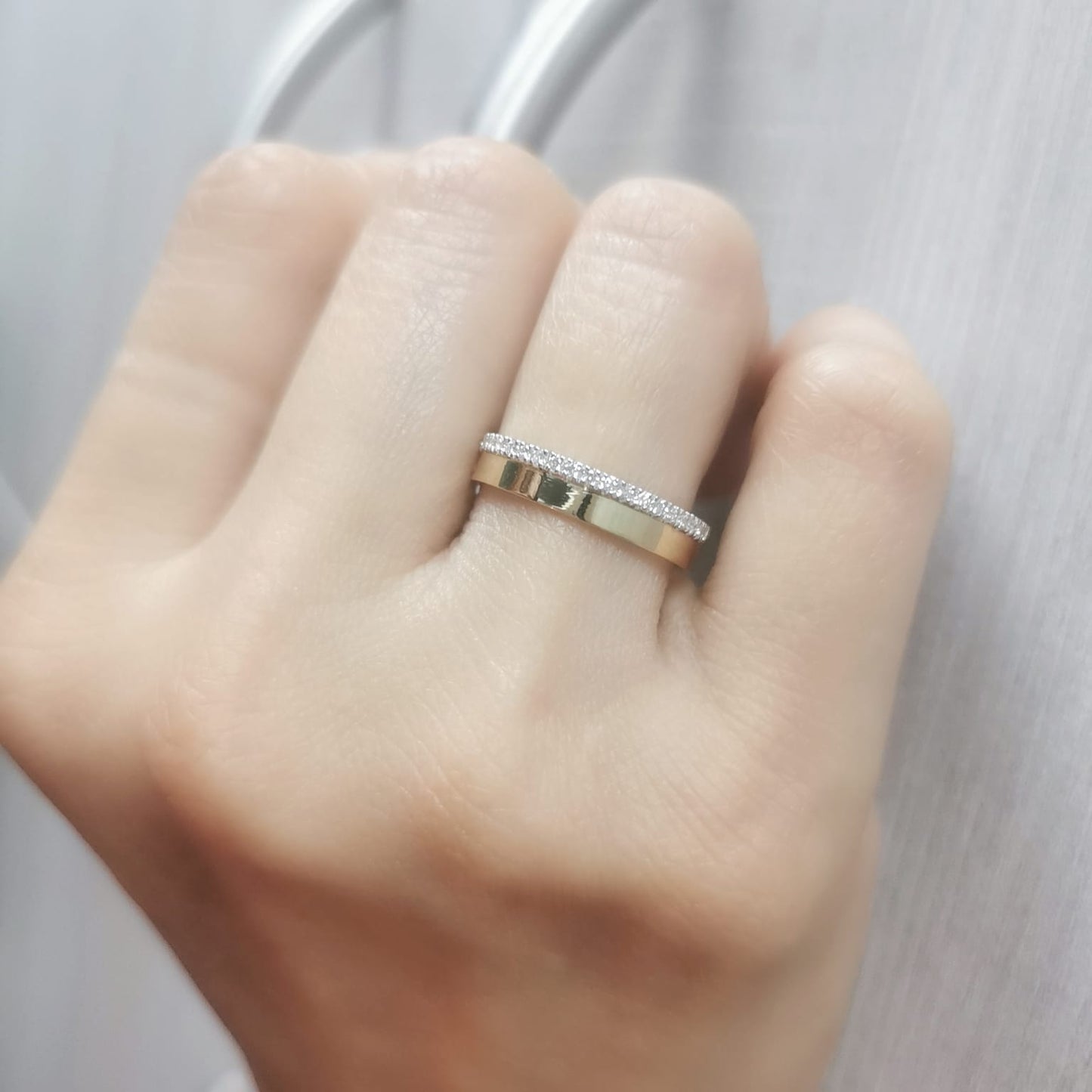 Elegant 18K gold diamond edge band featuring a delicate row of 0.20-carat diamonds along one side, perfect as a wedding band, stacking ring, or unisex fashion ring.