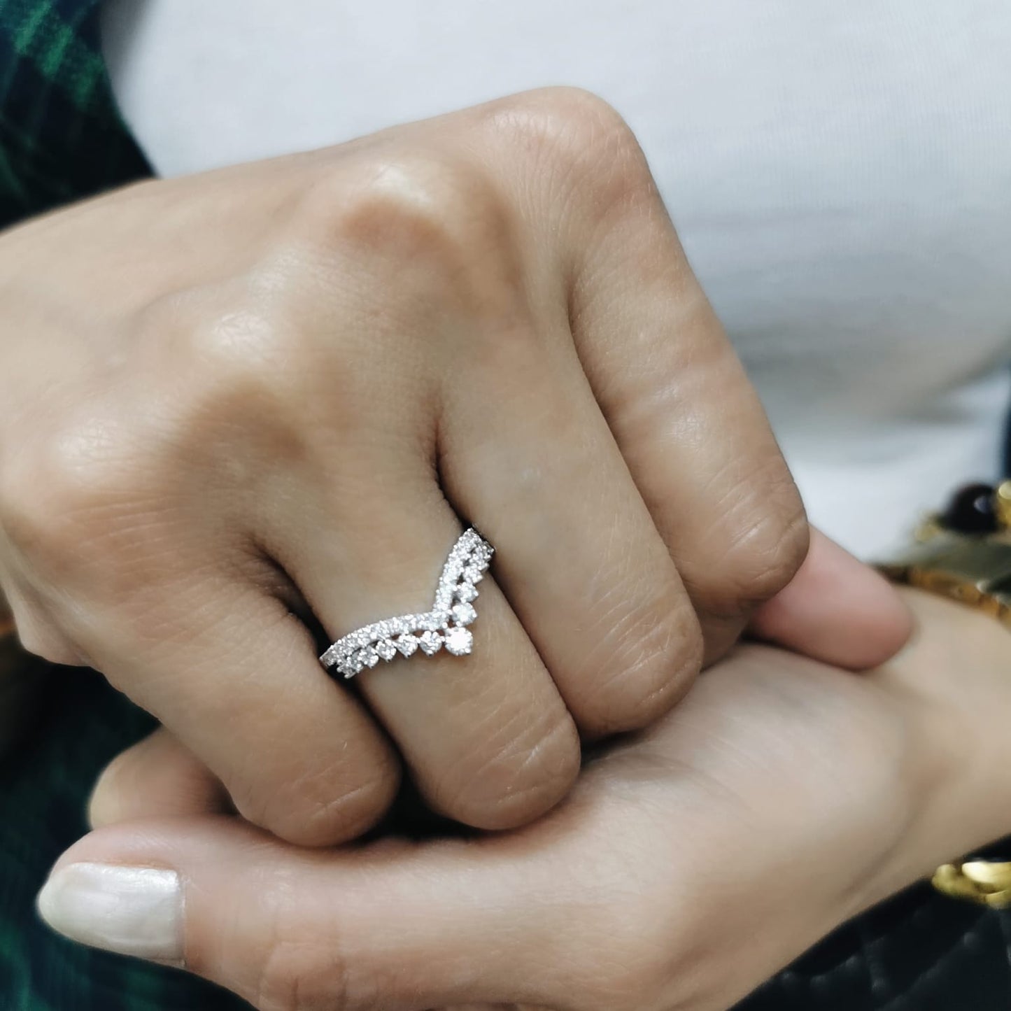 18K gold V-shape diamond ring with 0.47 carat round diamonds in a chevron silhouette
