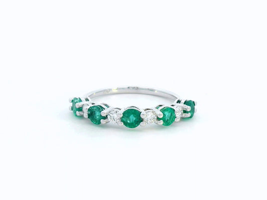 Elegant 18K white gold band with alternating round emeralds and diamonds – 0.94ct emeralds and 0.25ct diamonds.
