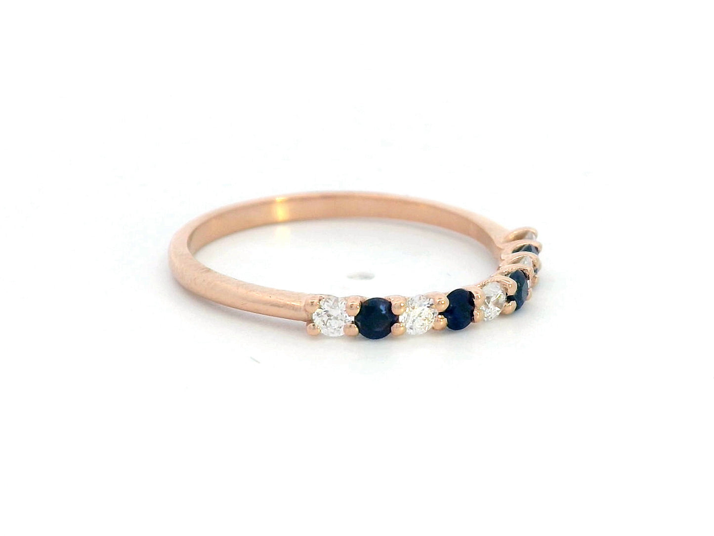 18K rose gold half eternity ring with alternating blue sapphires and diamonds