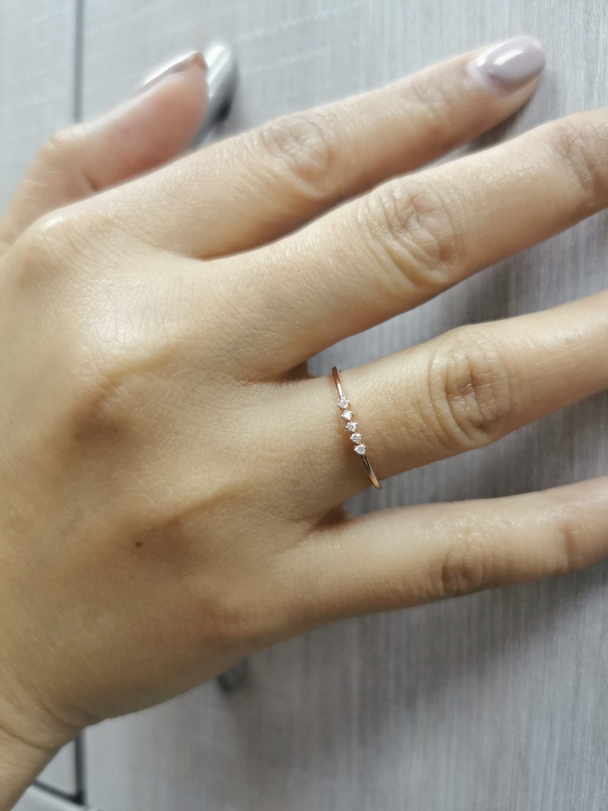 Five-stone diamond stacking ring in 18K rose gold with minimalist design