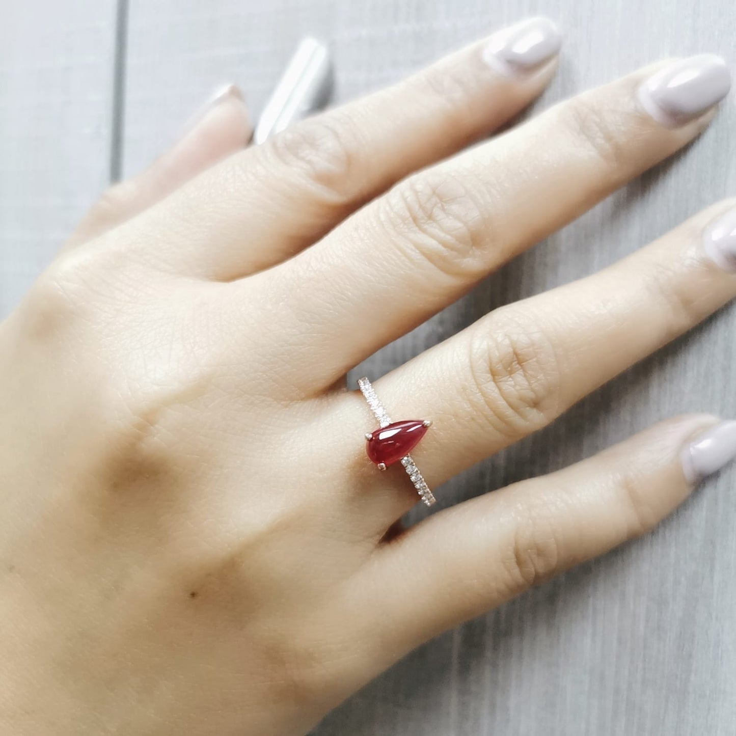 18K rose gold ring with pear-shaped cabochon ruby and diamond pavé band – 1.29 carat ruby