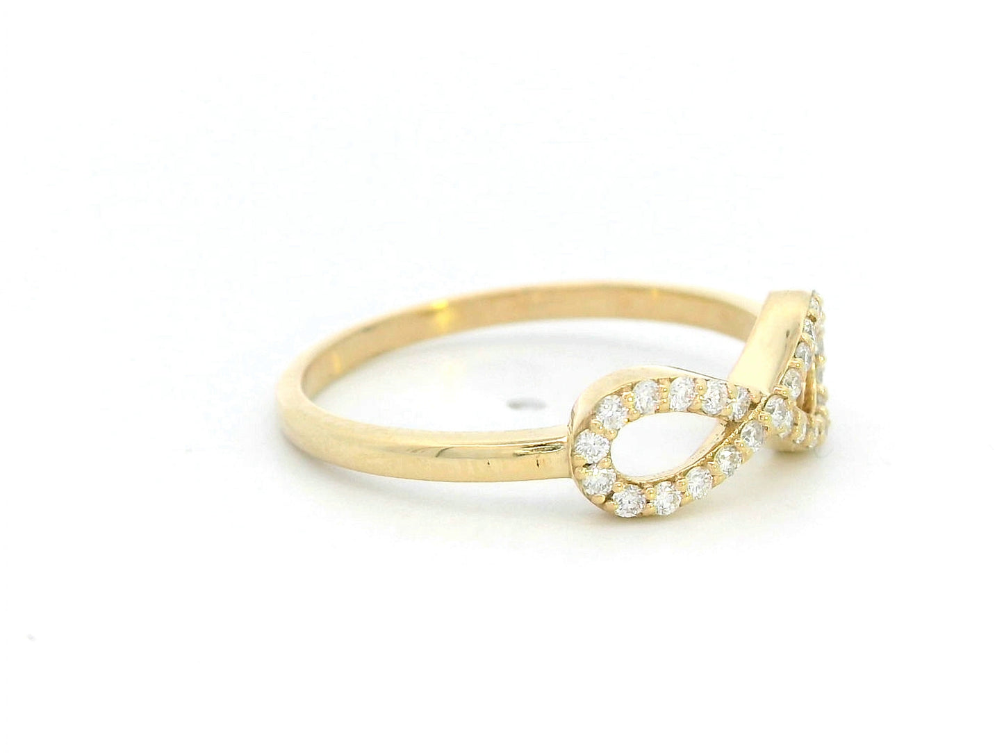 18K gold infinity ring with diamonds, symbolizing love, friendship & eternity.