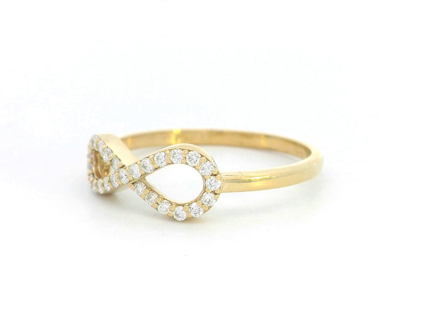 18K gold infinity ring with diamonds, symbolizing love, friendship & eternity.