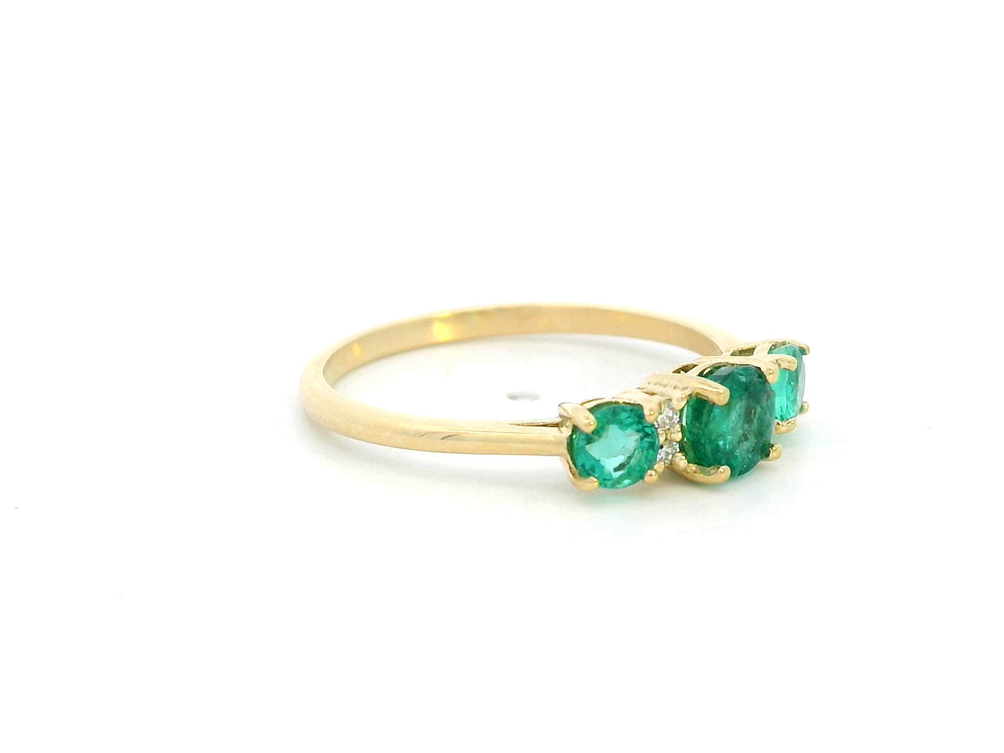 18K yellow gold emerald trilogy ring with diamond accents – 0.81ct emerald, 0.03ct diamond