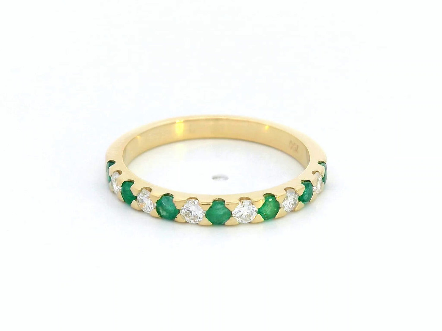 18K yellow gold eternity band with alternating emerald and diamond stones, elegant stacking ring