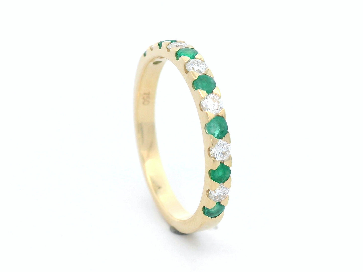 18K yellow gold eternity band with alternating emerald and diamond stones, elegant stacking ring