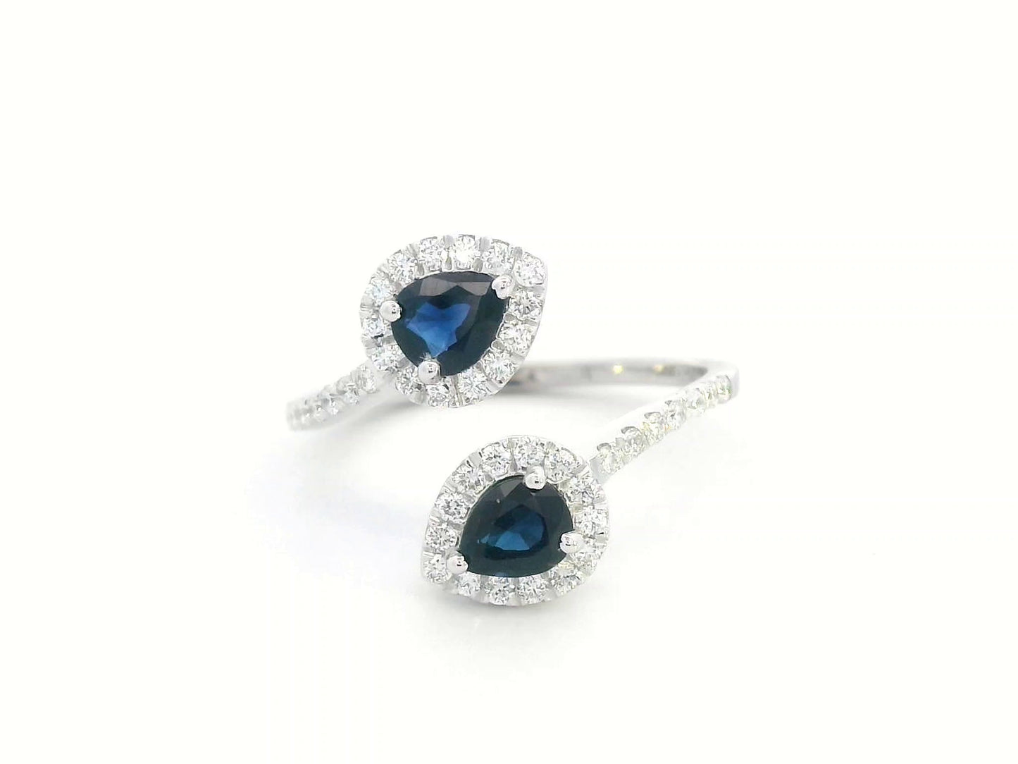 Pear-shaped sapphire and diamond bypass ring in 18K white gold with double halo design