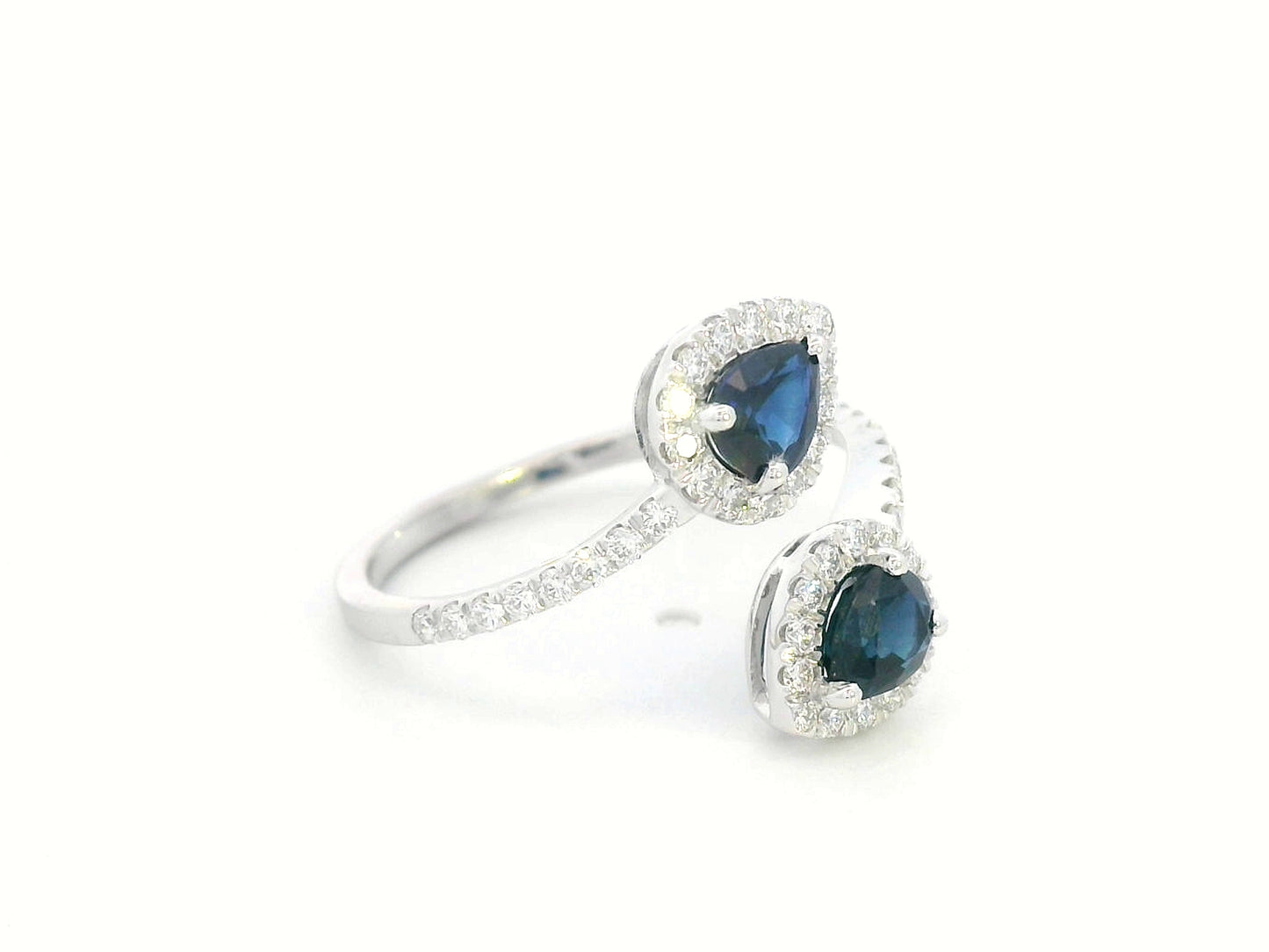 Pear-shaped sapphire and diamond bypass ring in 18K white gold with double halo design