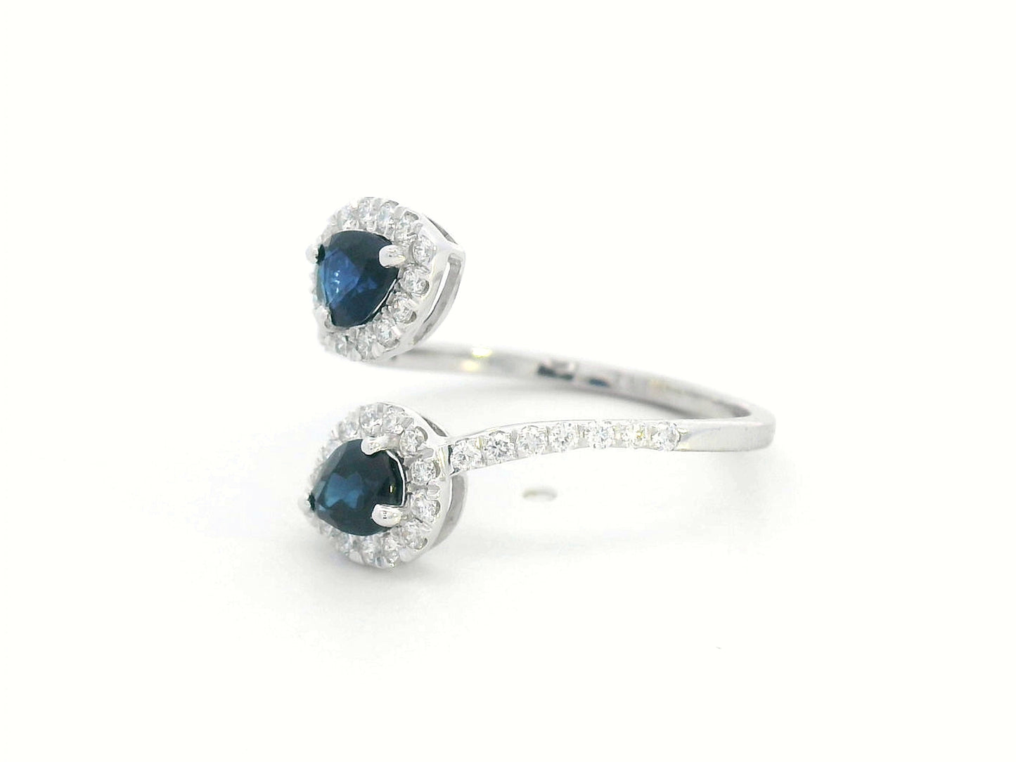 Pear-shaped sapphire and diamond bypass ring in 18K white gold with double halo design
