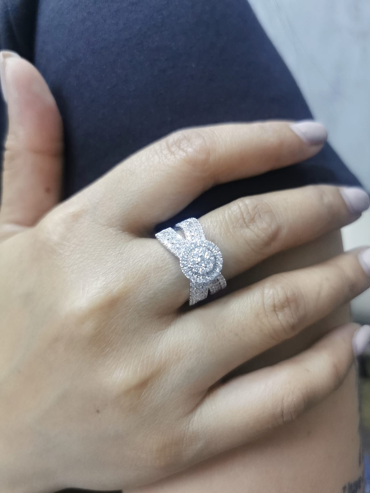 18K white gold diamond ring with round cluster center, halo, and split shank – 2.30 carats total.