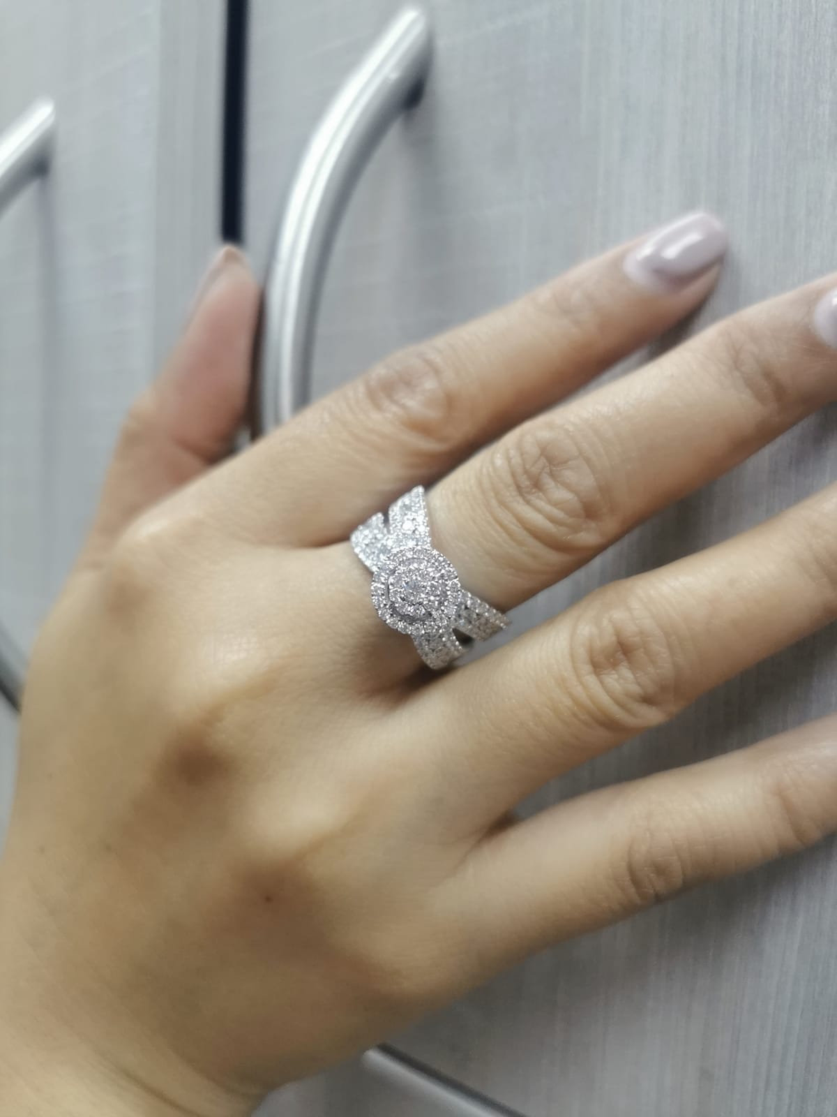 18K white gold diamond ring with round cluster center, halo, and split shank – 2.30 carats total.