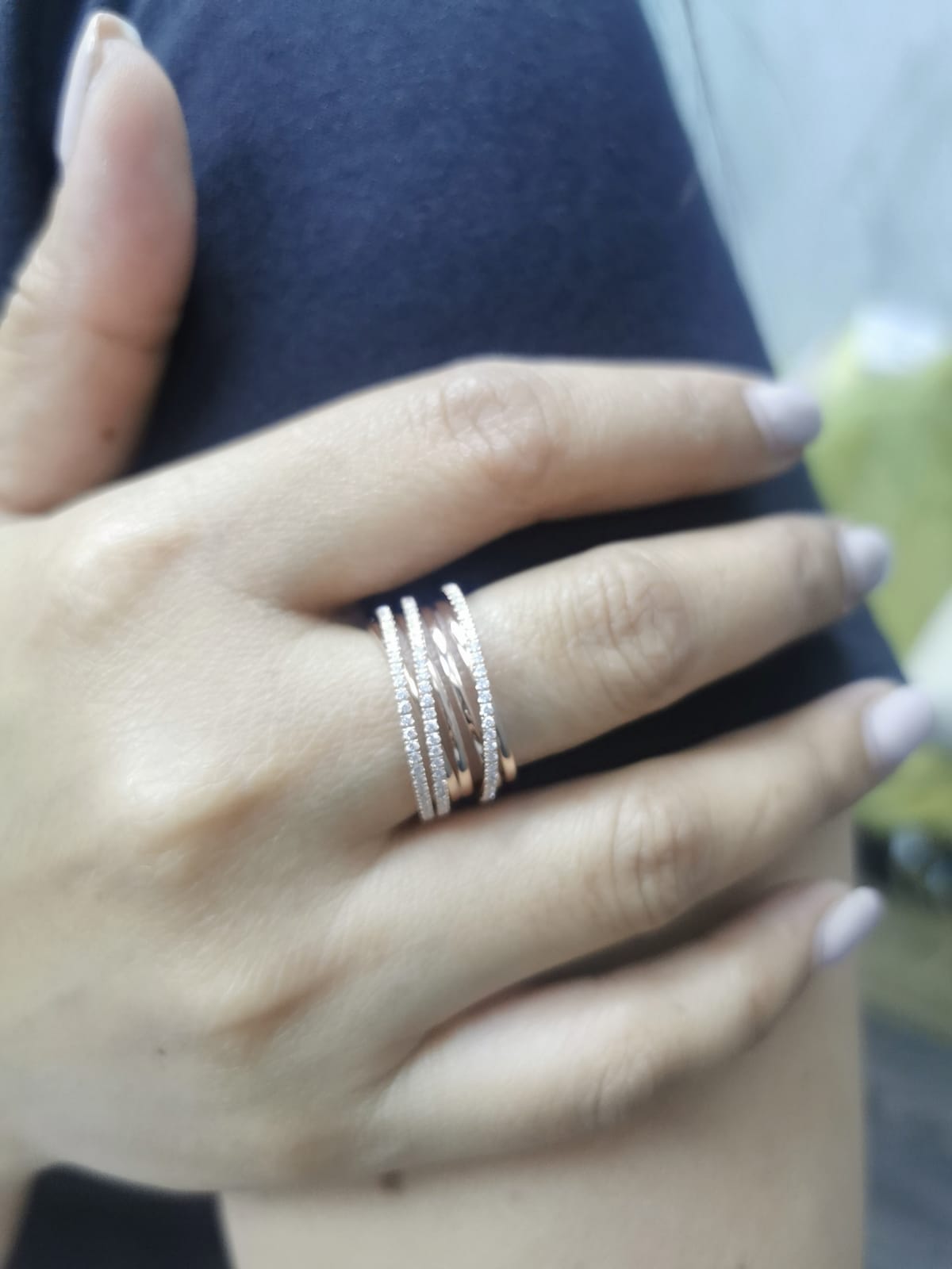 18K rose gold crossover ring with 0.46 carat round pavé diamonds, layered multi-band statement design.
