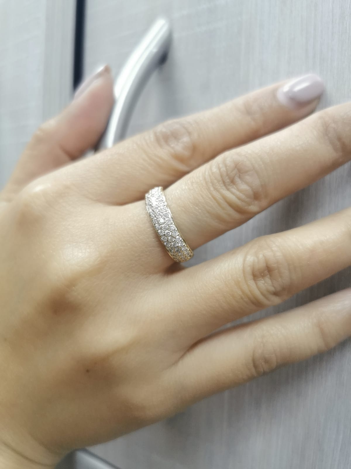 Three-row pavé diamond band ring in 18K yellow gold with 0.80 carats of round-cut diamonds