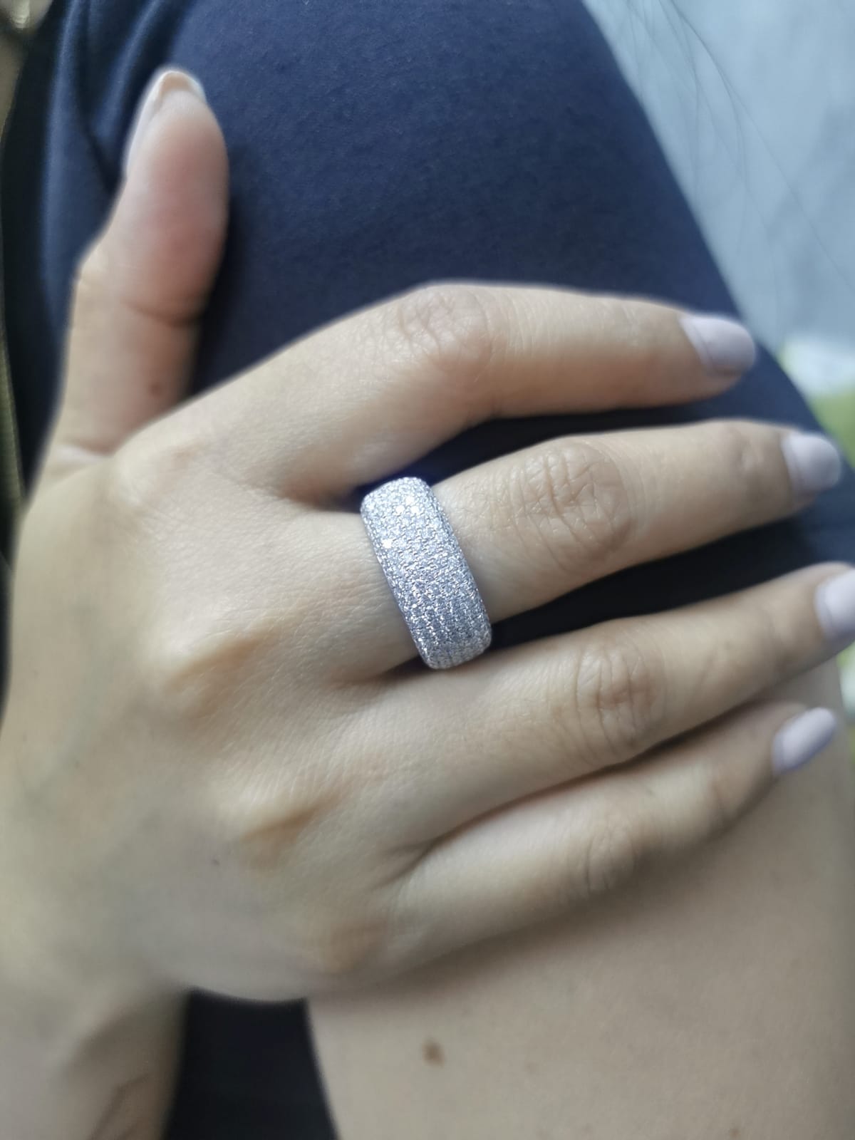 18K gold domed band ring with pavé diamonds covering the top half
