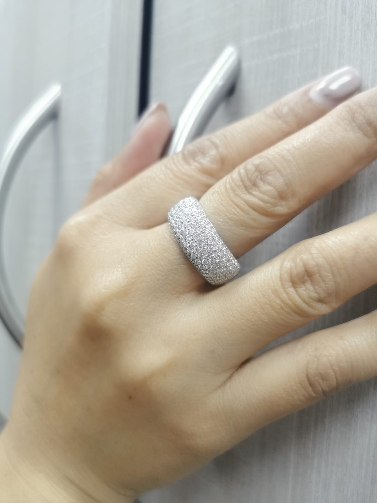 18K gold domed band ring with pavé diamonds covering the top half