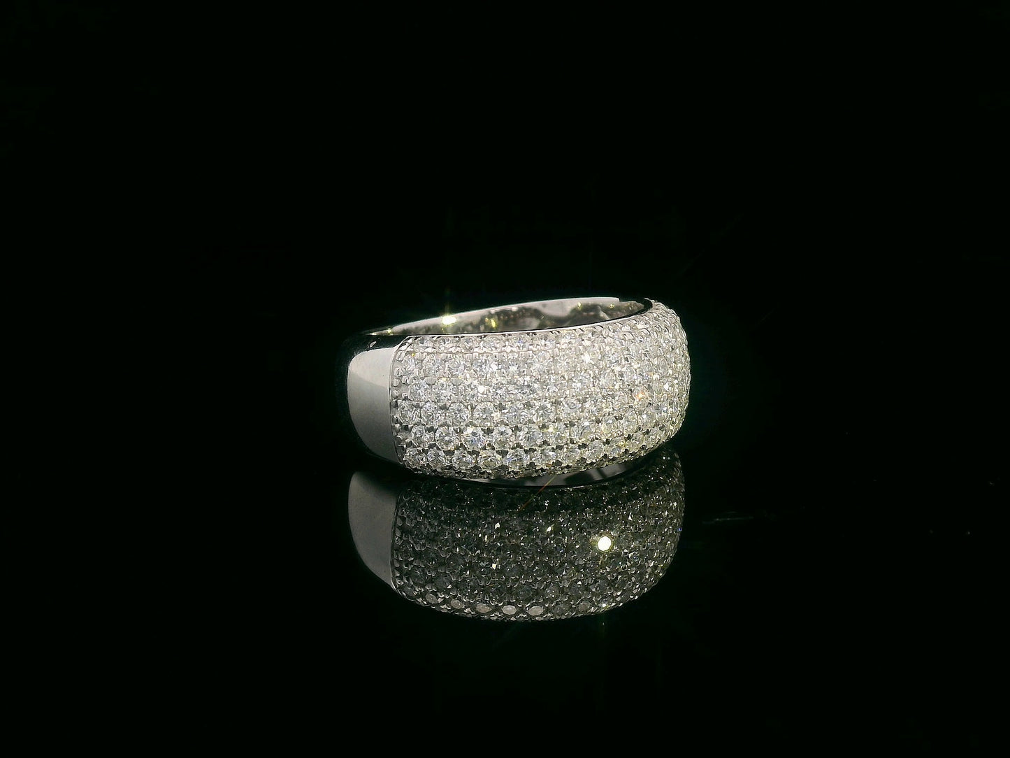 18K gold domed band ring with pavé diamonds covering the top half