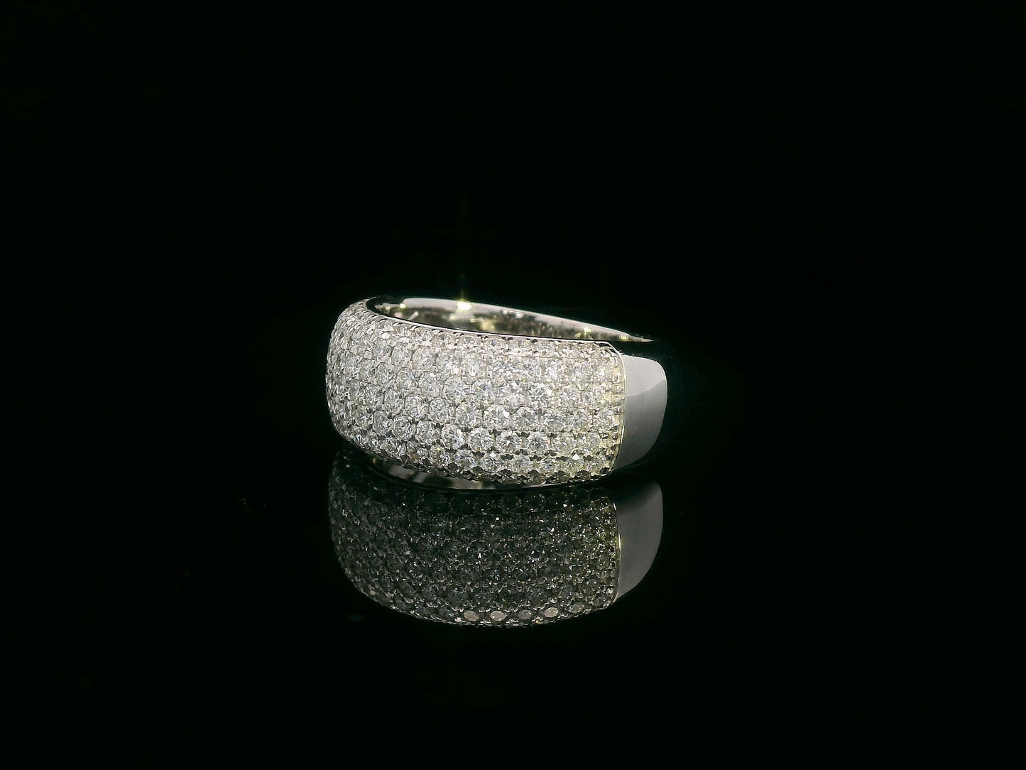 18K gold domed band ring with pavé diamonds covering the top half