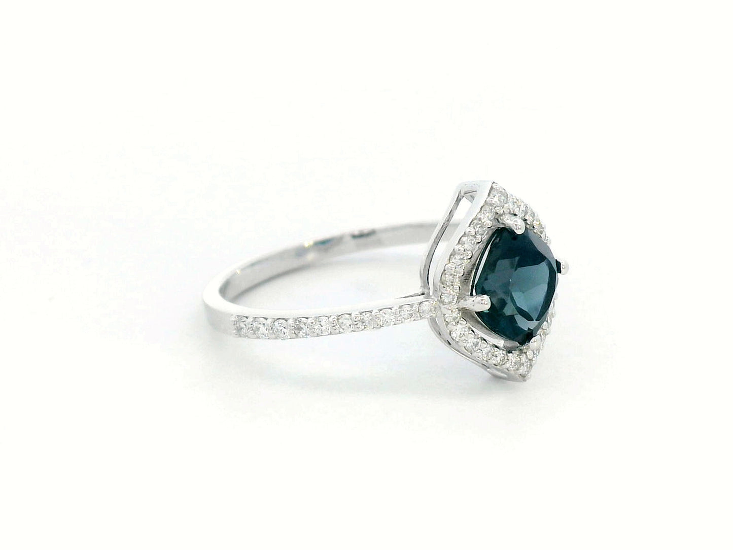 Cushion-cut London Blue Topaz ring with diamond halo and pavé diamond band in 18K gold