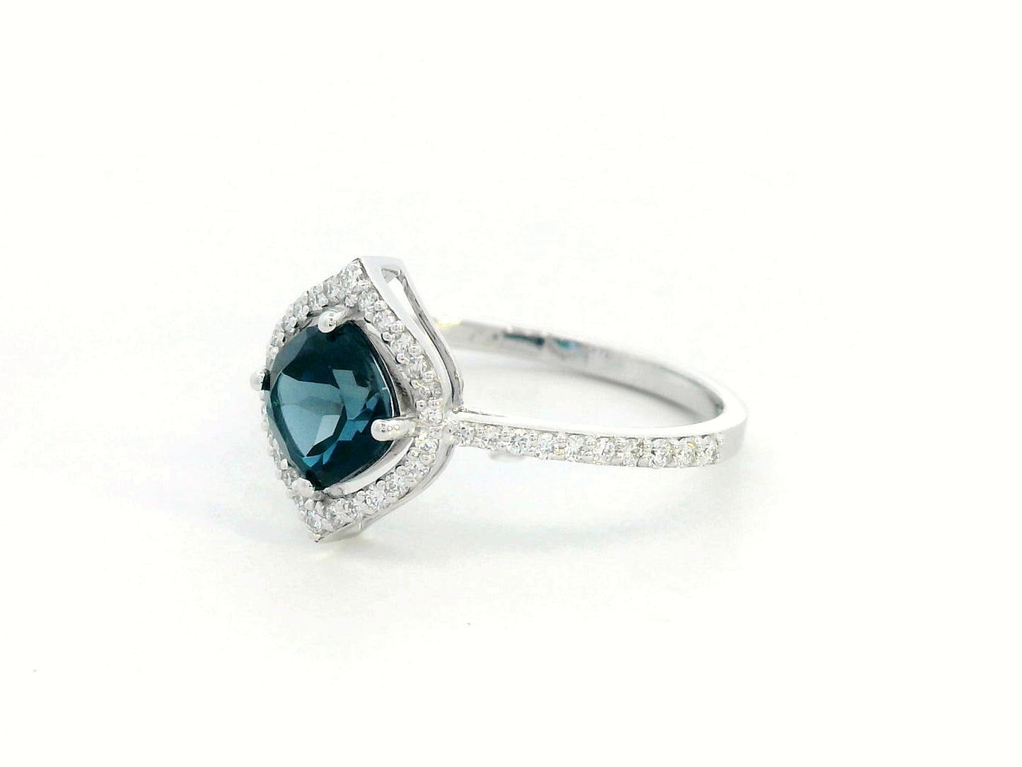 Cushion-cut London Blue Topaz ring with diamond halo and pavé diamond band in 18K gold