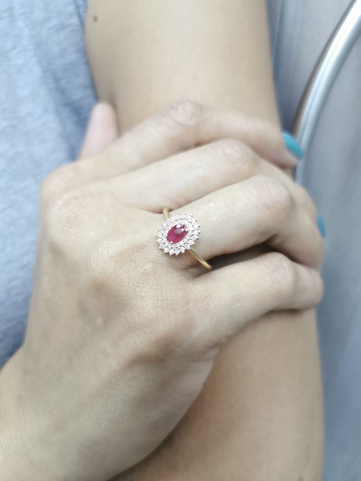 18K gold oval ruby and diamond halo ring with double halo design