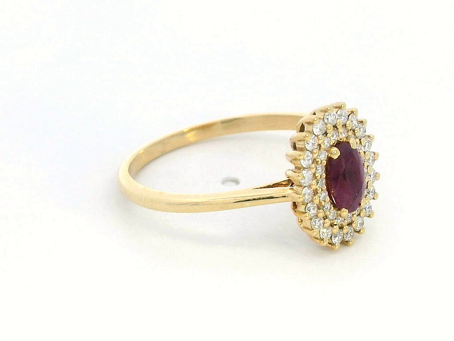 18K gold oval ruby and diamond halo ring with double halo design