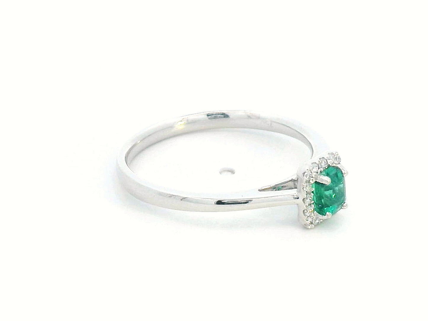 18K white gold ring with emerald-cut 0.36ct emerald and diamond halo – 0.07ct diamonds