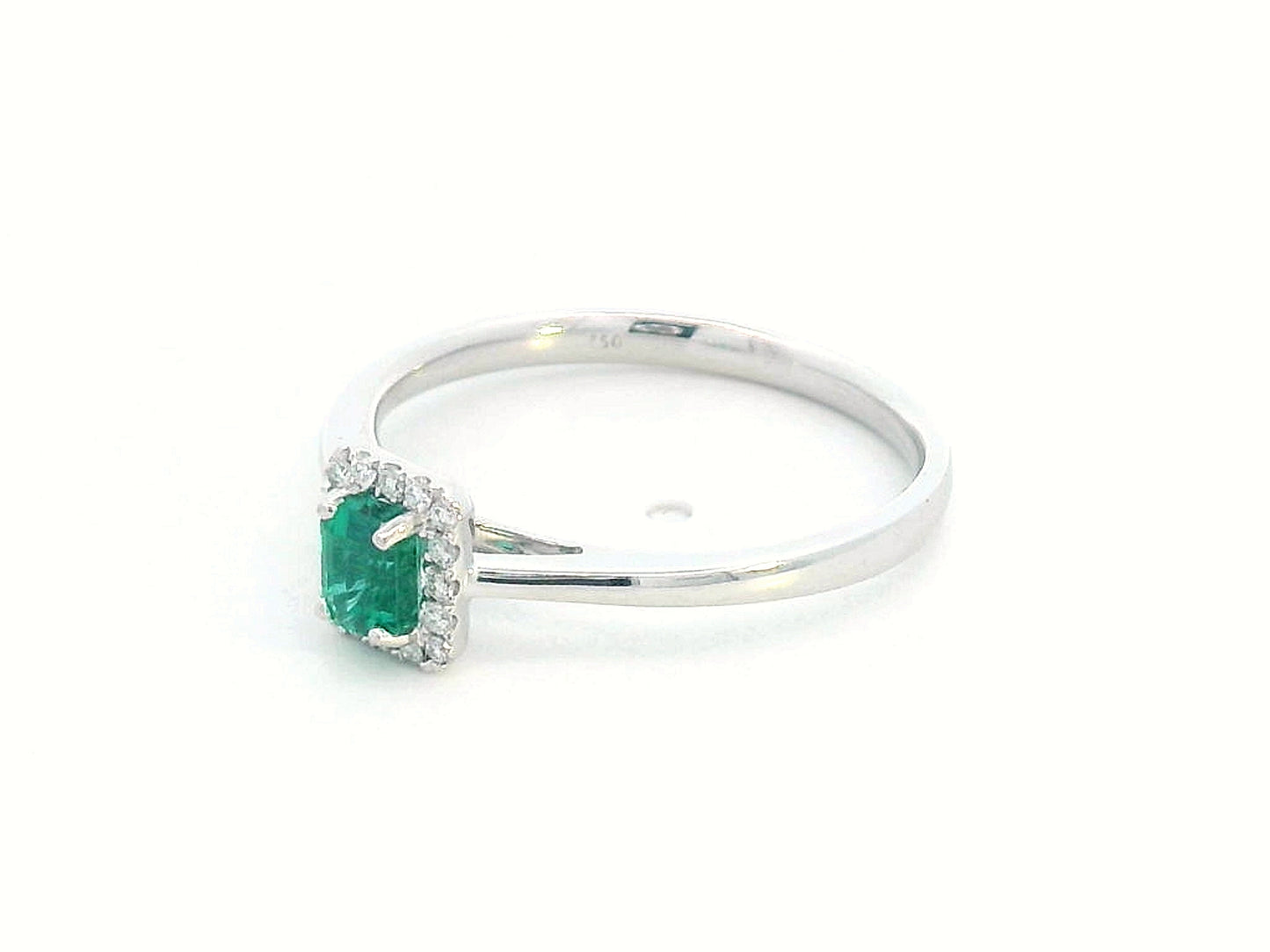 18K white gold ring with emerald-cut 0.36ct emerald and diamond halo – 0.07ct diamonds